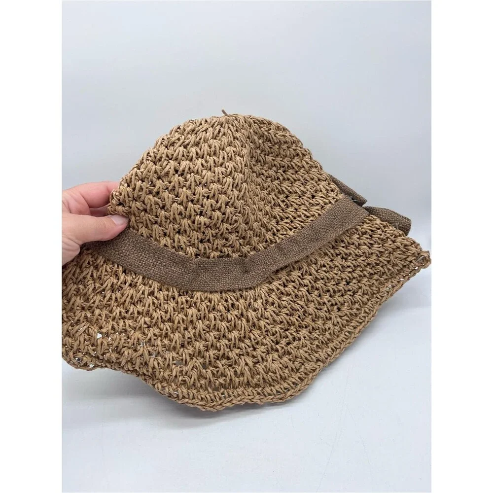 Women’s crocheted straw cloche hat with a bowknot
